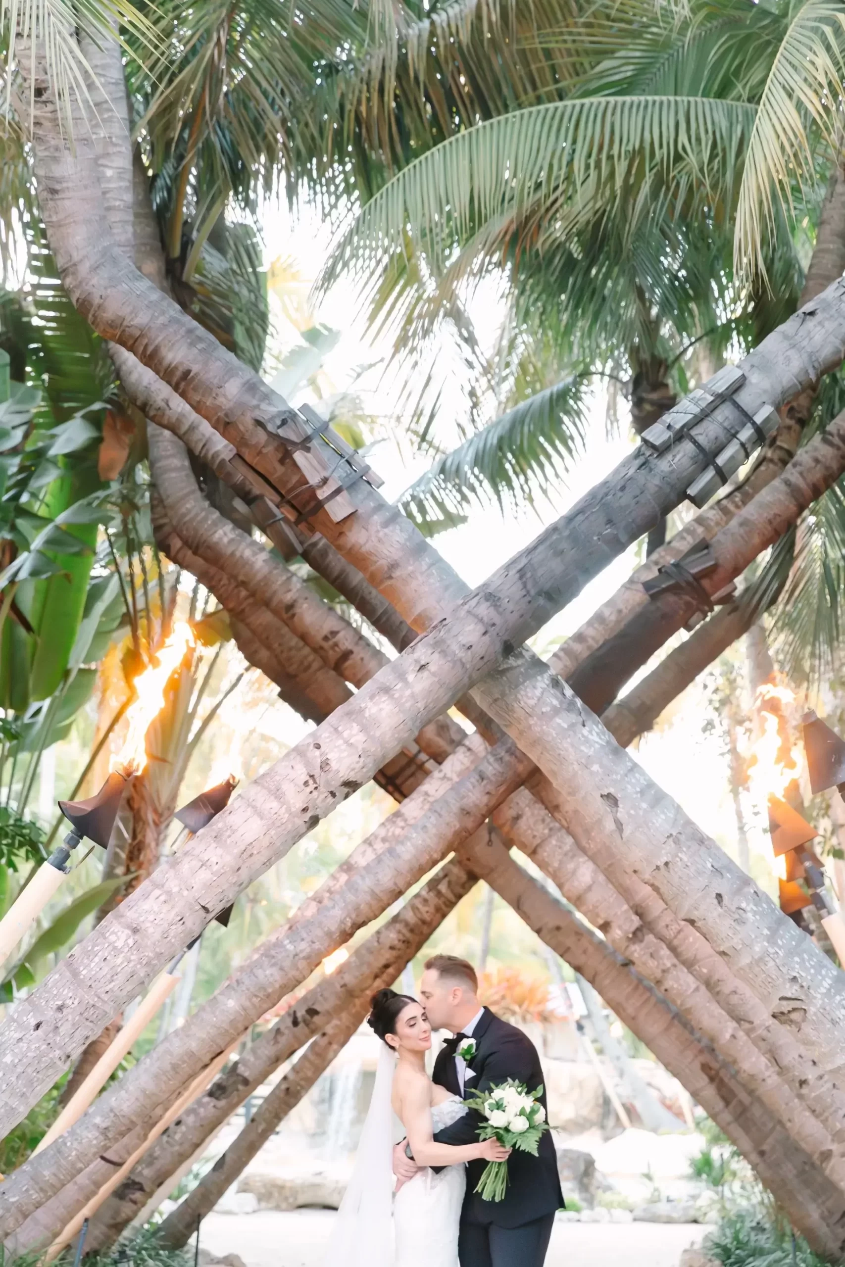 Bride and Groom Walking besides the beach.